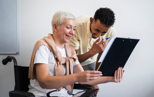 A personal support worker helping an elderly patient